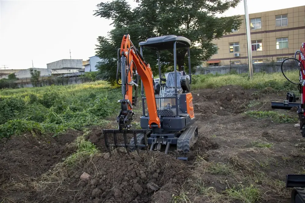 mini excavator with landscape rake for soil preparation