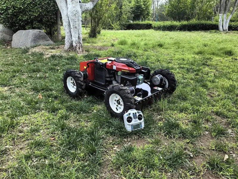 remote control wheel lawn mower with handheld controller on grass