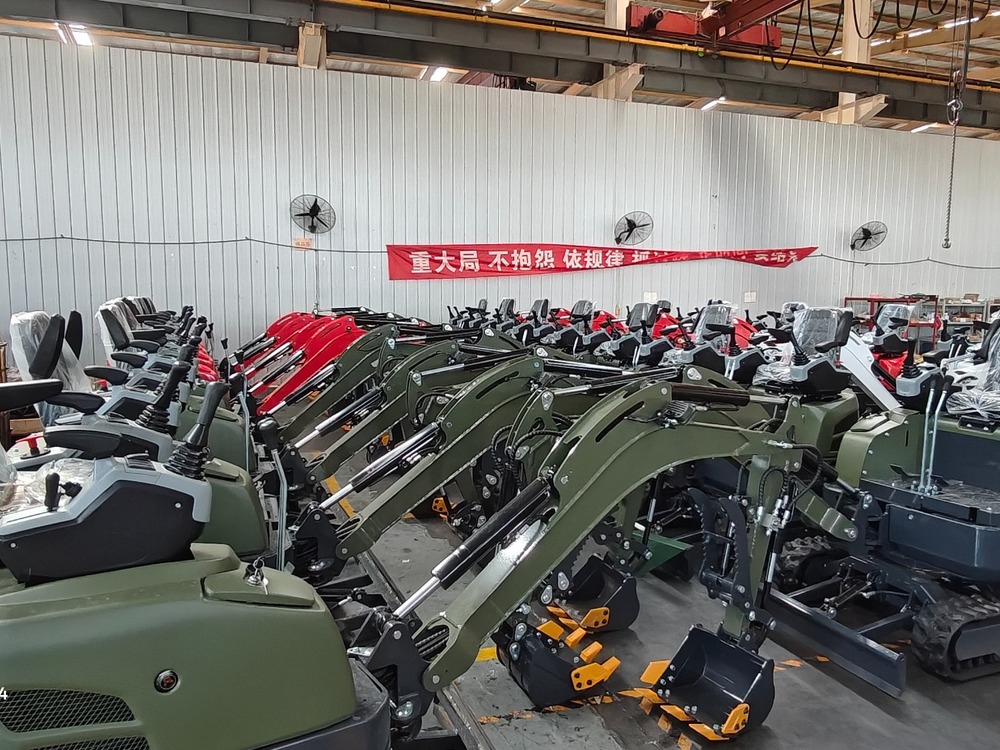 Compact mini excavators arranged for product inspection in a workshop