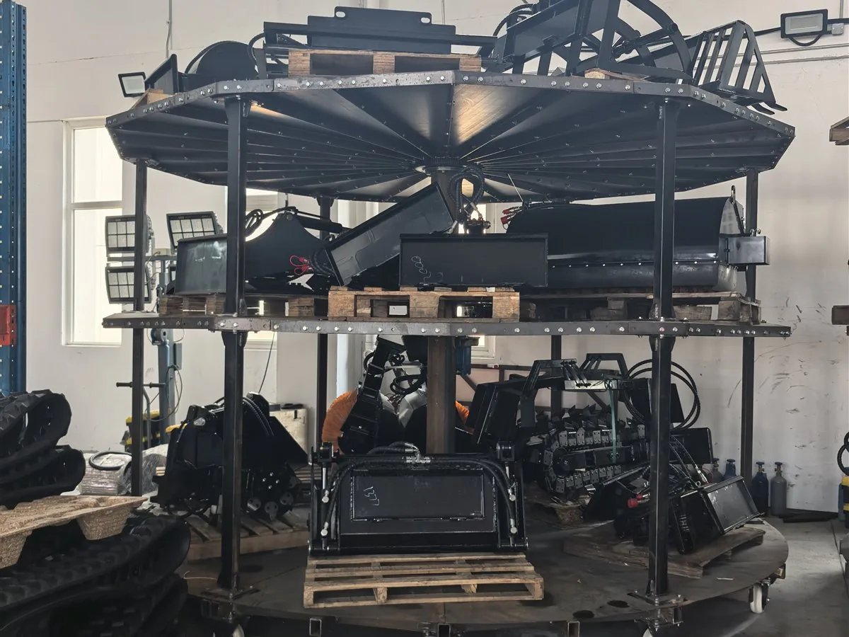 Mini skid steer loader frames and components prepared in the workshop