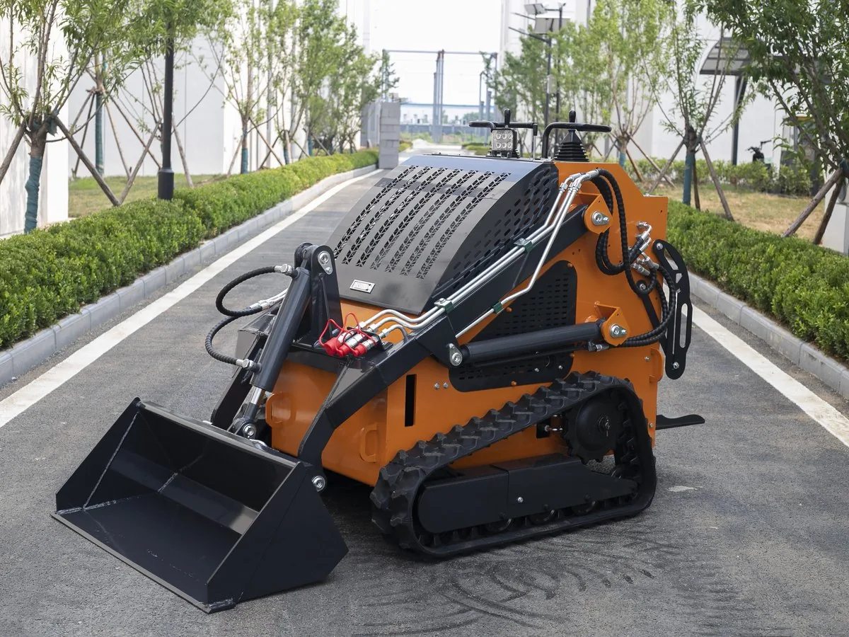 Orange KORVA T460 tracked mini skid steer loader comparison view