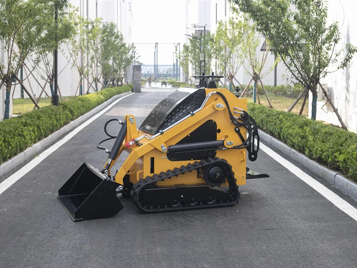 KORVA T360 tracked mini skid steer loader side view with triangular rubber tracks