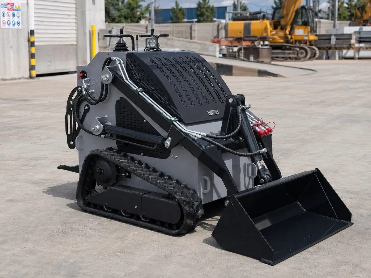 Gray customized KORVA T460 tracked mini skid steer loader for dealer fleets
