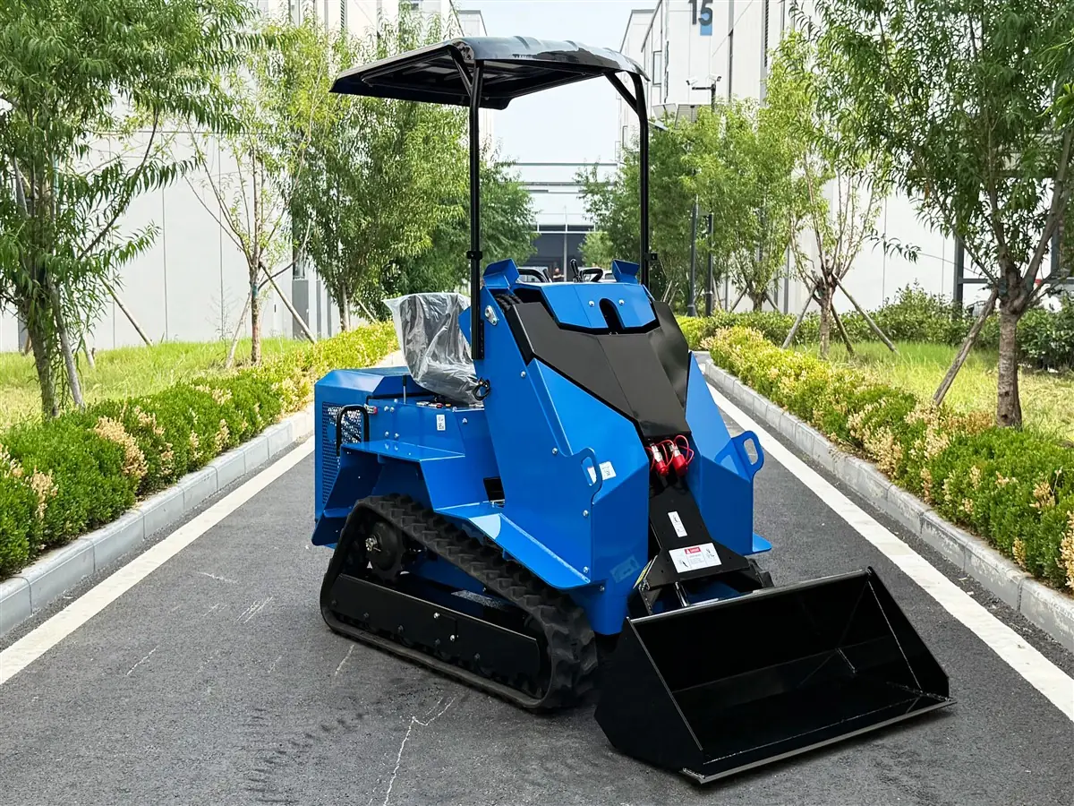 KORVA T490 ride-on tracked mini skid steer loader front angle with bucket