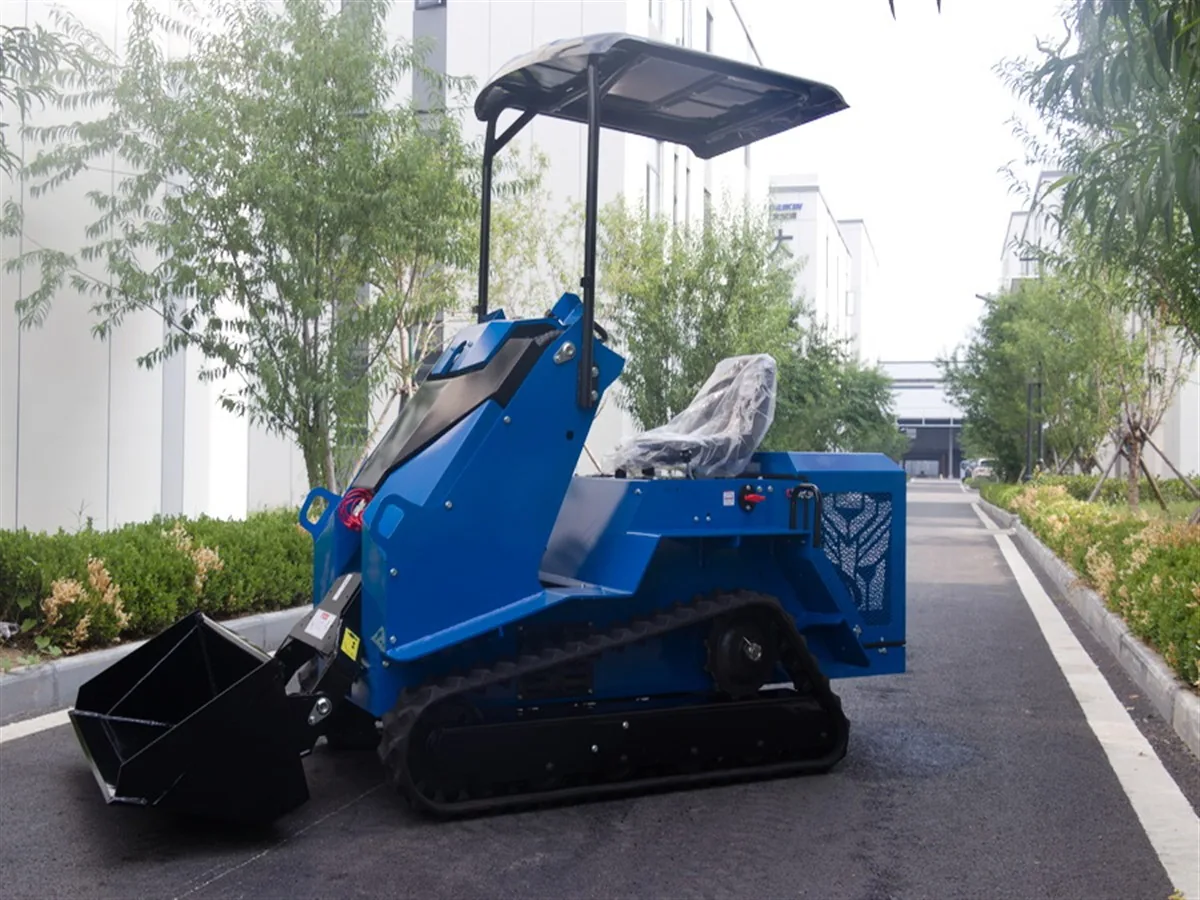 KORVA T490 ride-on tracked mini skid steer loader side profile with bucket lowered